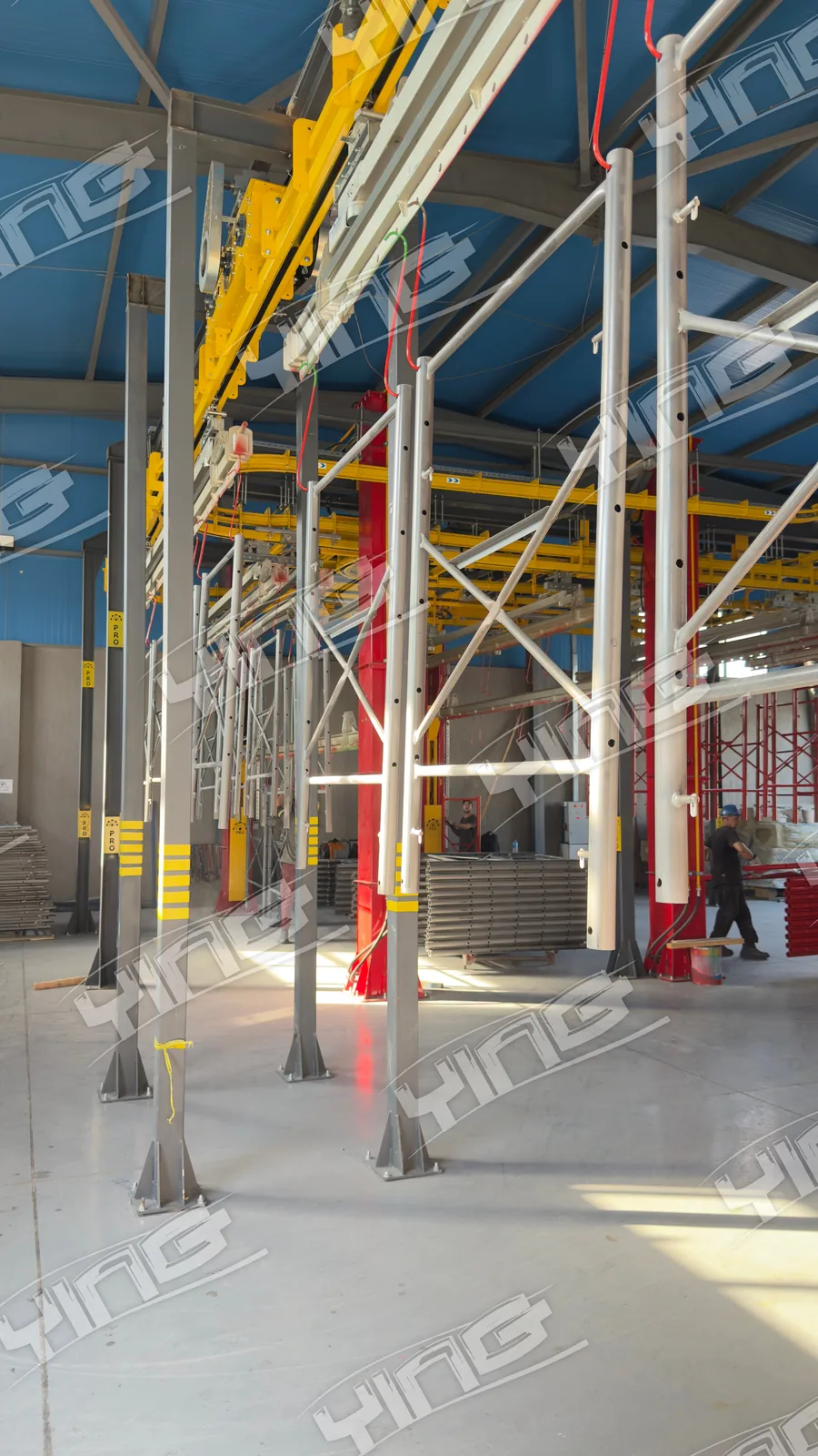 The power and free conveyor running the length of the ACROW Misr coating hall