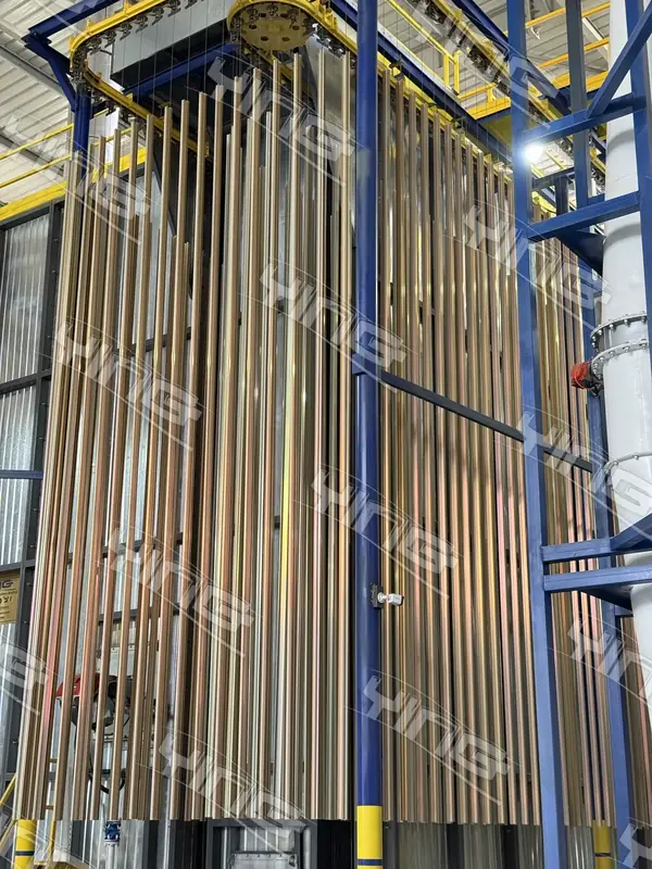 Coated aluminium profiles hanging on the conveyor line